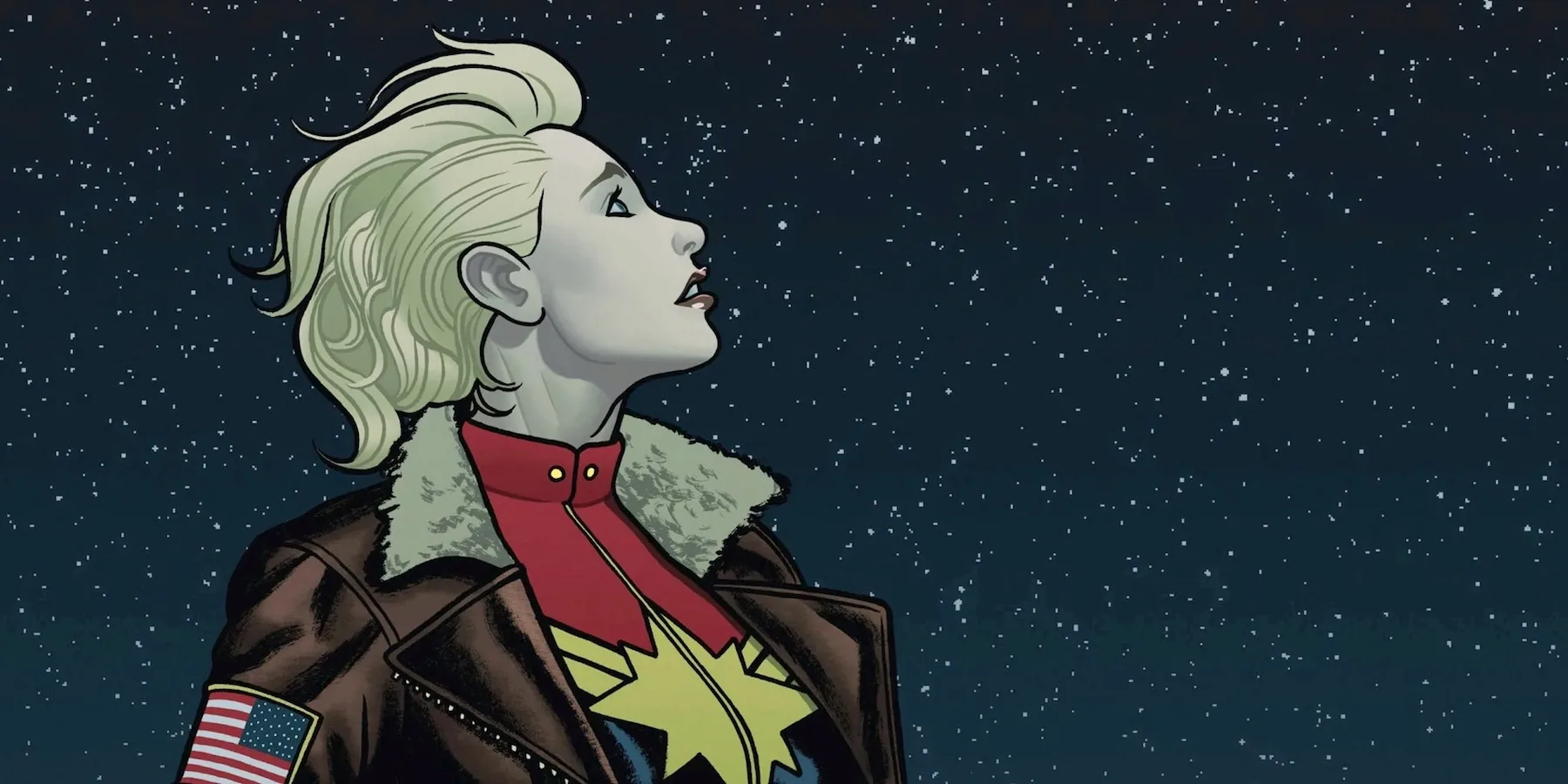 Carol Danvers in flight jacket under a starry sky, comic art